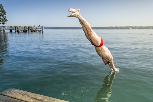 An image of a man jumping into the water