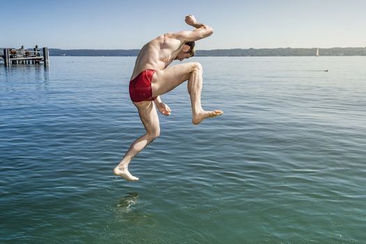 An image of a man jumping into the water