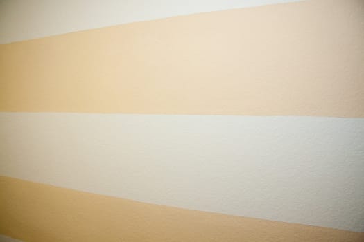A striped wall gets smaller from right to left for a unique abstract texture background.