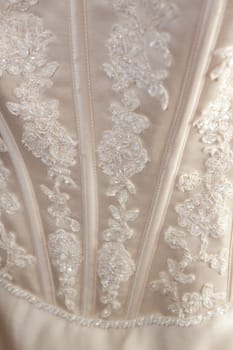 Detail of the fabric of a fancy wedding dress.