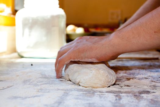 A baker prepares handmade artisan bread for baking.