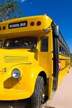 Front of Yellow School Bus with Blue Sky