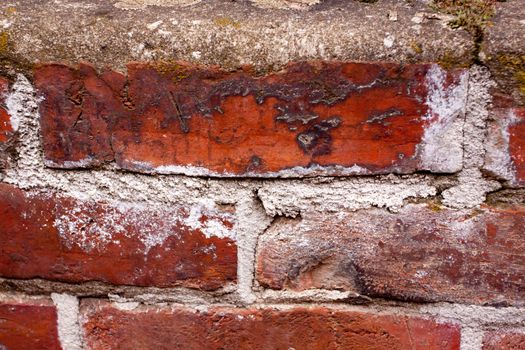 Old bricks are decaying and falling apart on this interesting textured background image.