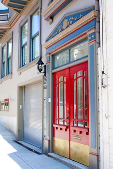 Red doors highlight the entryway to an historic home in downtown San Francisco.