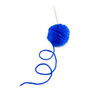 ball of blue wool and metal needle