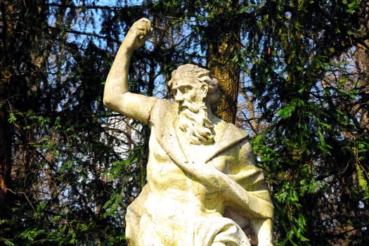 The old crackle statue of a man in the garden of Konopiste chateau in Prague, Czech Republic