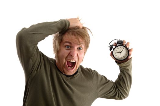 Outraged man with alarm clock in hand