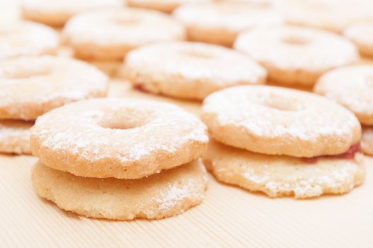 Closeup of Traditional Linzer Cookies on Wooden Board 