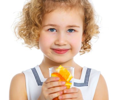 Portrait of happy little girl drinking orange juice. Isolated over white background.