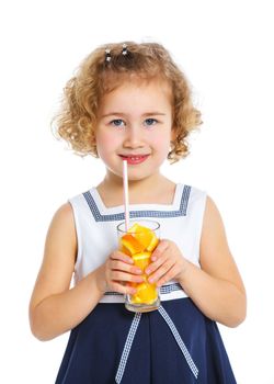 Portrait of happy little girl drinking orange juice. Isolated over white background.
