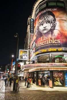 LONDON, UK - NOVEMBER 05: The Queen's Theatre corner in Shaftesbury Avenue at night. Commonly known as the West End,  the area is home to London's most popular musicals. November 05, 2012 in London.