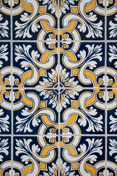 Traditional spanish ceramic tiles in yellow, white and blue