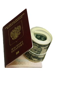 Stack of paper usa dollars inside the red passport