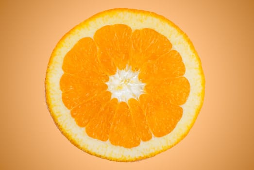 Closeup of orange slice on orange gradient background.