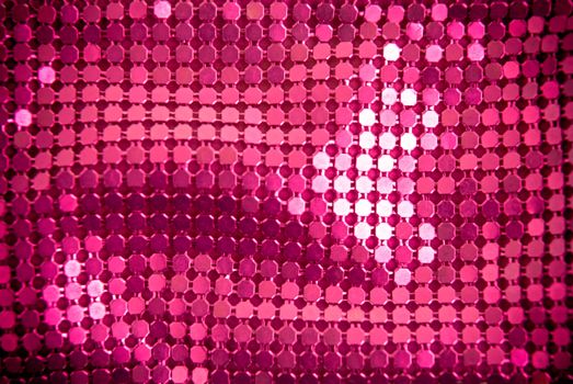 Bright pink paillette texture background.