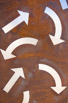 Rusty turn arrow signs background.