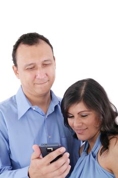 Couple looking at a cell phone and smiling isolated on a white background