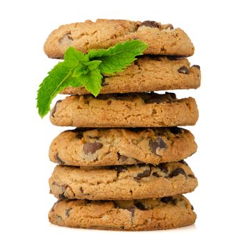 Chocolate cookies with mint leaves isolated on white background.