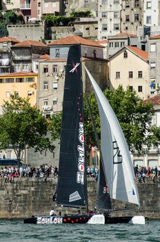 PORTO, PORTUGAL - JULY 07: ZouLou compete in the Extreme Sailing Series boat race on july 07, 2012 in Porto, Portugal.