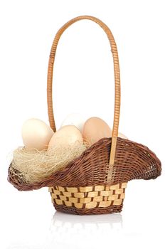 Eggs on a basket isolated on white background.