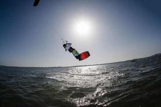 Kiteboarder enjoy surfing on a sunny day.