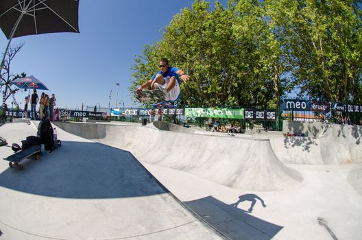 VISEU, PORTUGAL - JULY 22: Joao Sa grab during pool trainings at DC Skate challenge by MEO on july 22, 2012 in Viseu, Portugal.