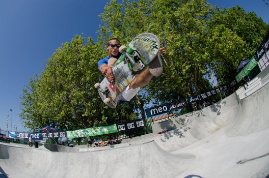 VISEU, PORTUGAL - JULY 22: Joao Sa grab during pool trainings at DC Skate challenge by MEO on july 22, 2012 in Viseu, Portugal.