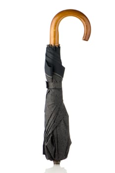 Closed umbrella isolated on white background.