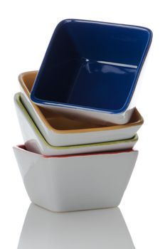 Colorful bowls stacked one above the other on white background.