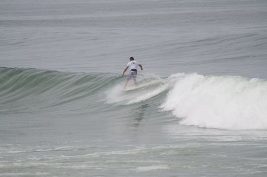 OVAR, PORTUGAL - AUGUST 19: Unidentified surfer at 1st stage of National Longboard Championship  on august 19, 2012 in Ovar, Portugal.