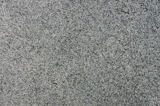 Closeup of grey granite texture background.