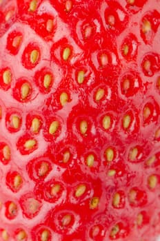 Macro of a red ripe strawberry texture.
