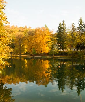 Beautiful colors of autumn landscape by the lake