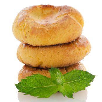 Homemade biscuits with eggs and cream on white background.