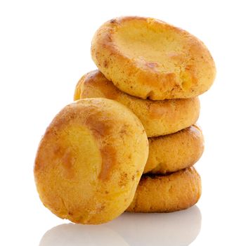 Homemade biscuits with eggs and cream on white background.