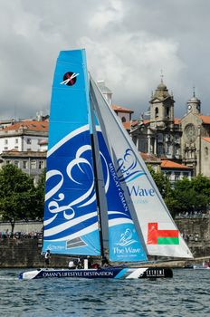 PORTO, PORTUGAL - JULY 07: The Wave - Muscat compete in the Extreme Sailing Series boat race on july 07, 2012 in Porto, Portugal.
