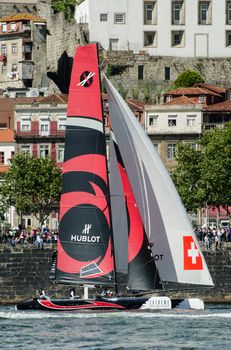 PORTO, PORTUGAL - JULY 07: Alinghi compete in the Extreme Sailing Series boat race on july 07, 2012 in Porto, Portugal.