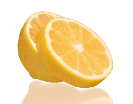 Half of lemon with slice isolated on white background