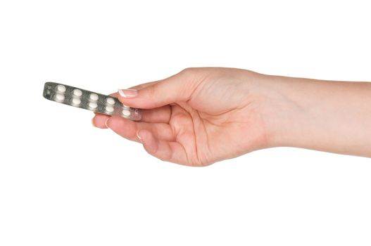 Pills in woman hand isolated on white background