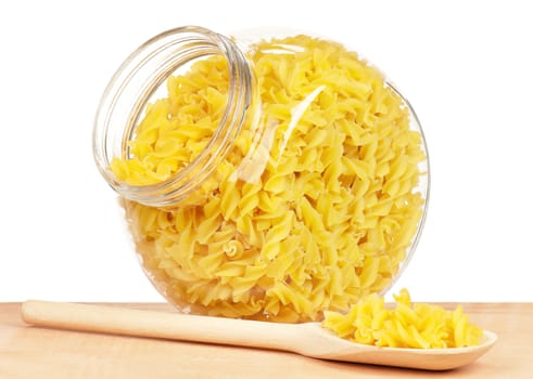 Pasta in glass pot isolated on white background