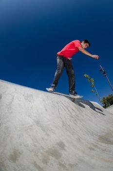 Skateboarder doing a bs disaster on a curb.