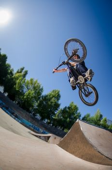 High BMX jump in a skate park.