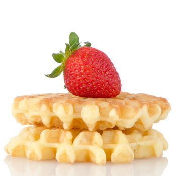 Waffles and strawberry isolated on white background.