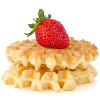 Waffles and strawberry isolated on white background.