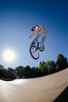 High BMX jump in a skate park.