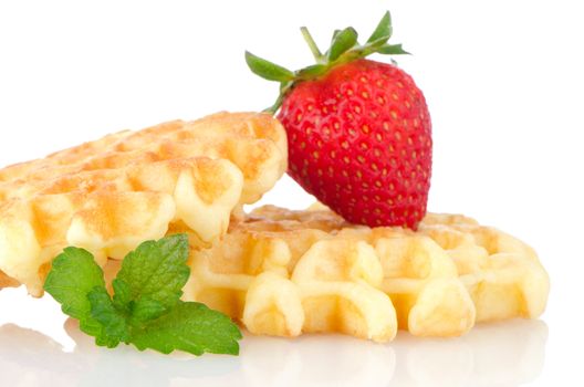 Waffles and strawberry isolated on white background.