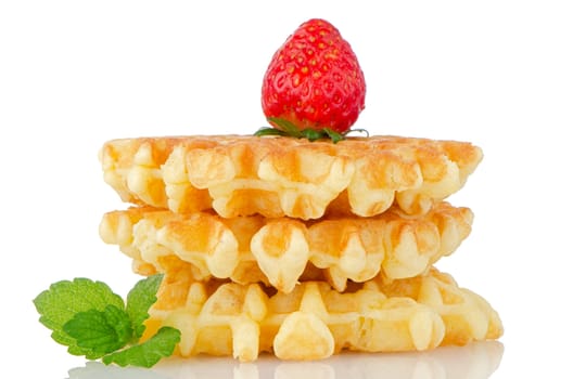 Waffles and strawberry isolated on white background.