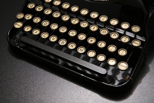 a typewriter in dramatic lighting.