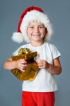 little girl dressed as Santa with gift