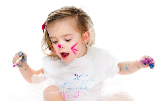 cute little girl with a brush on a white background